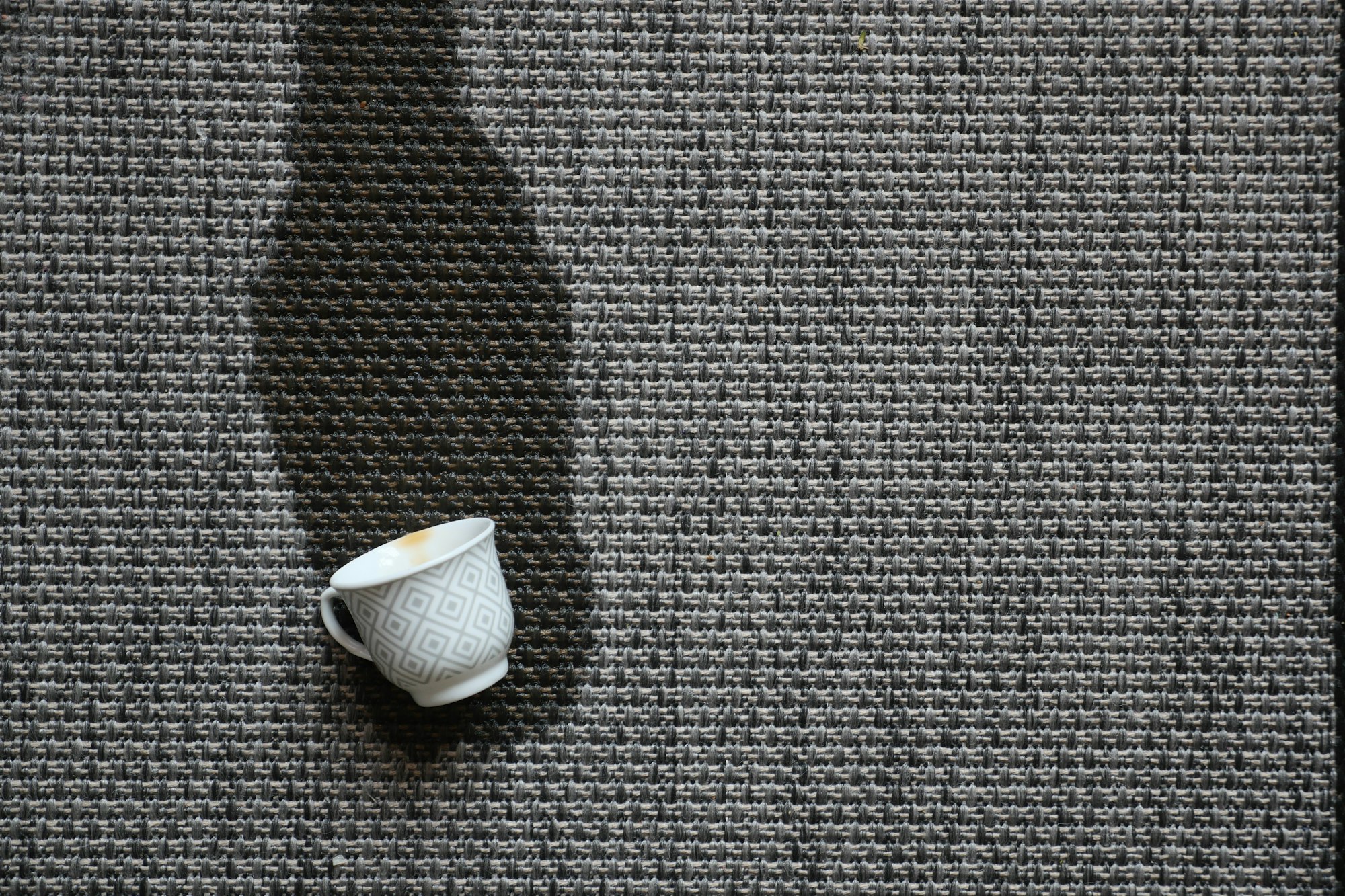 cup of coffee spilled on carpet